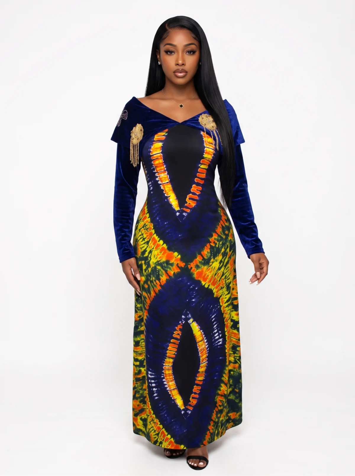 Fictional Black woman modelling a blue, orange and green floor-length dress in a clean studio